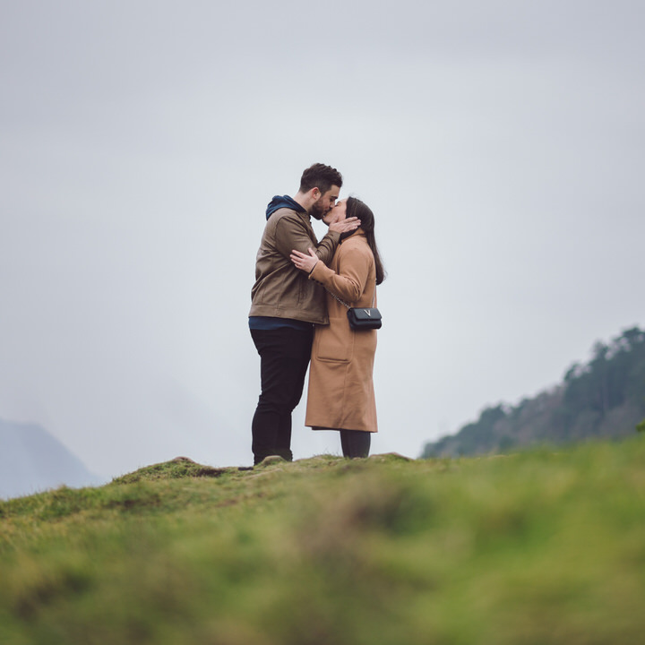 Couple kiss on top of hill in Llandudno North Wales