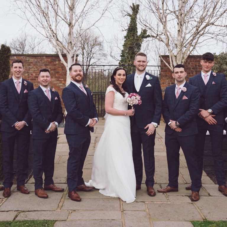 Groom party wedding portrait outside Lion Quays in Oswestry 