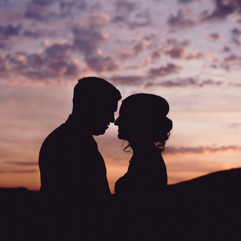 Sunset silhouette of Bride & Groom featuring mountains during wedding photography at Chester wedding