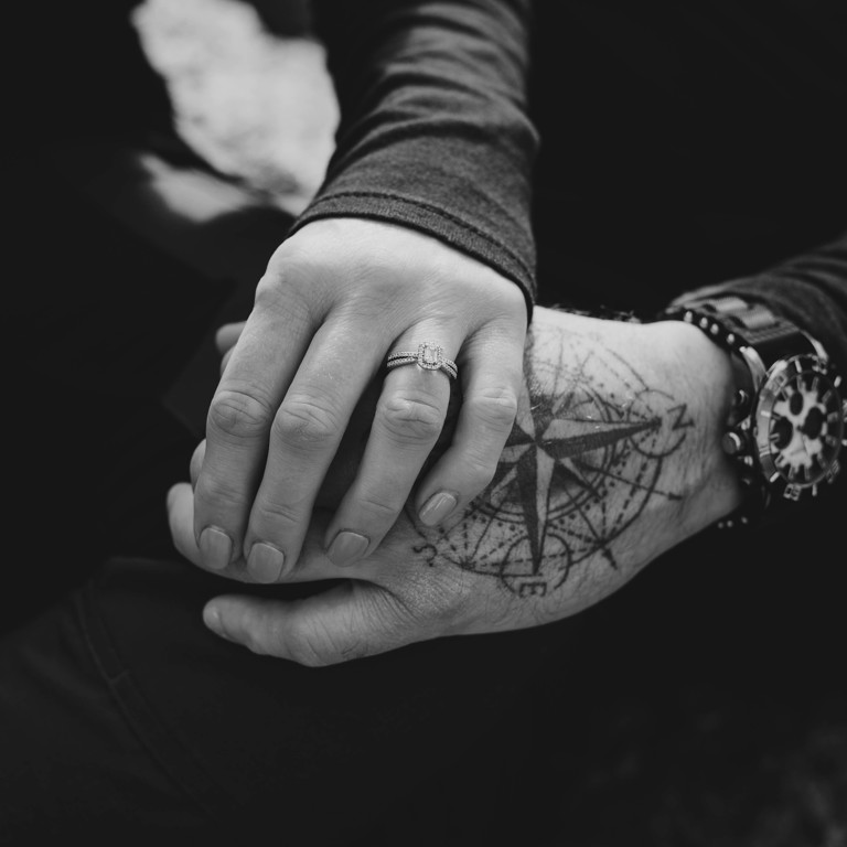 Close up of hands and engagement ring in North Wales