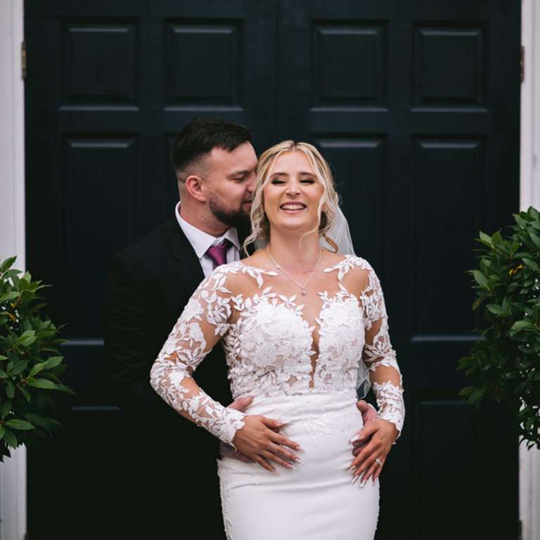 Wedding photography, Bride & Groom laugh in front of Old Palace Chester