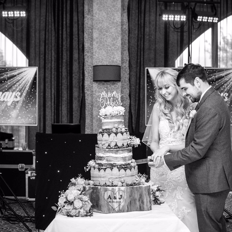 Bride and Groom Wedding cake cutting at Lion Quays hotel Oswestry