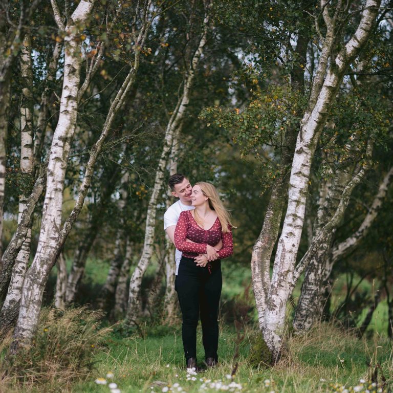 Engaged couple hug during photoshoot in North Wales