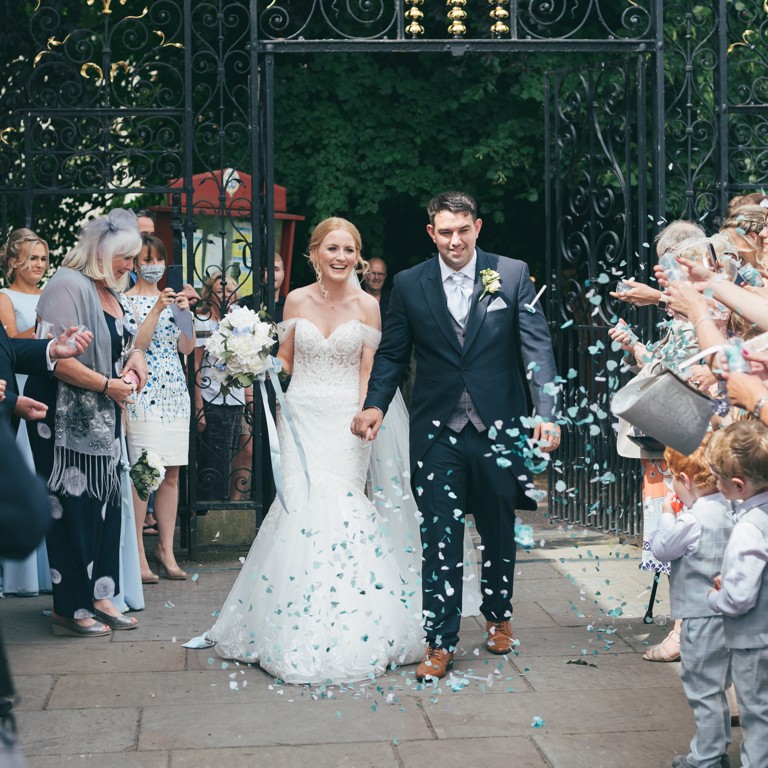 Bride & Groom confetti shot outside wedding venue in Ruthin North Wales