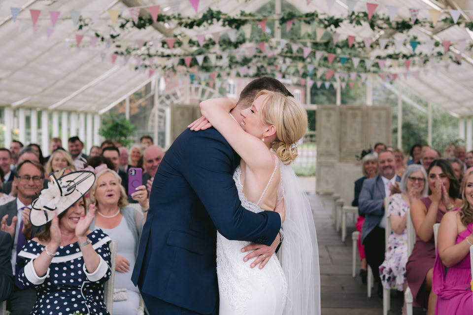Bride & Groom hug after wedding ceremony at Abbeywood Estate wedding