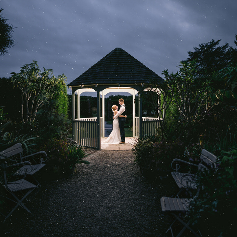 Night time Wedding photography under pergoda at North Wales wedding