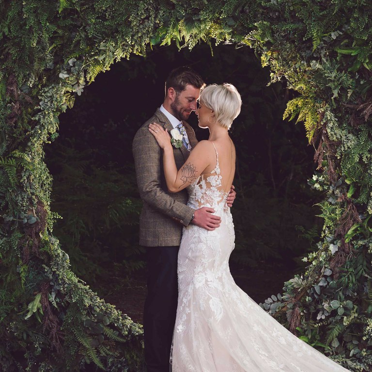 Bride & Groom hold each other during wedding photography at local wedding