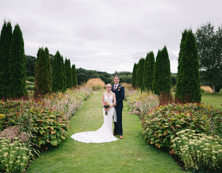 Bride & Groom pose during wedding at Abbeywood Estate Chester