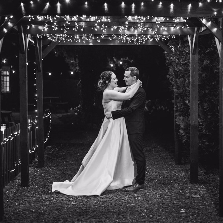 Night time Wedding photography under pergoda at Rossett Hall