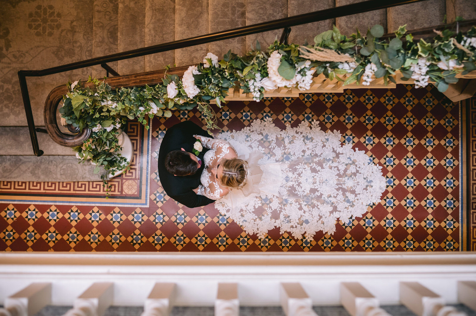 Photograph of Bride & Groom from top of stairs at Old Palace Chester, Cheshire wedding