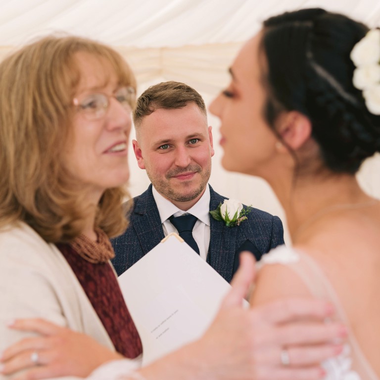 Groom looks lovingly at Bride during Marquee wedding in Penyffordd North Wales