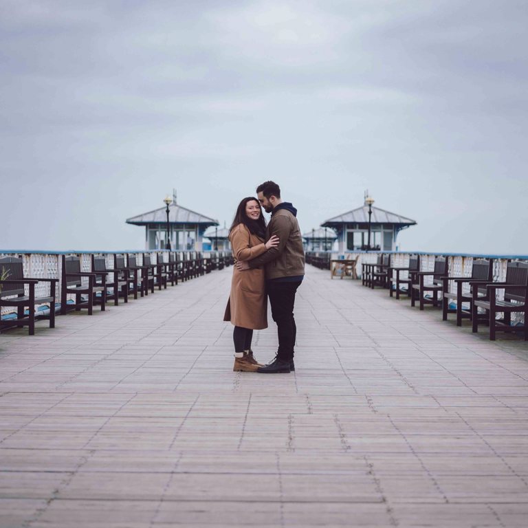 Engaged couple on pier in Llandudno North wales