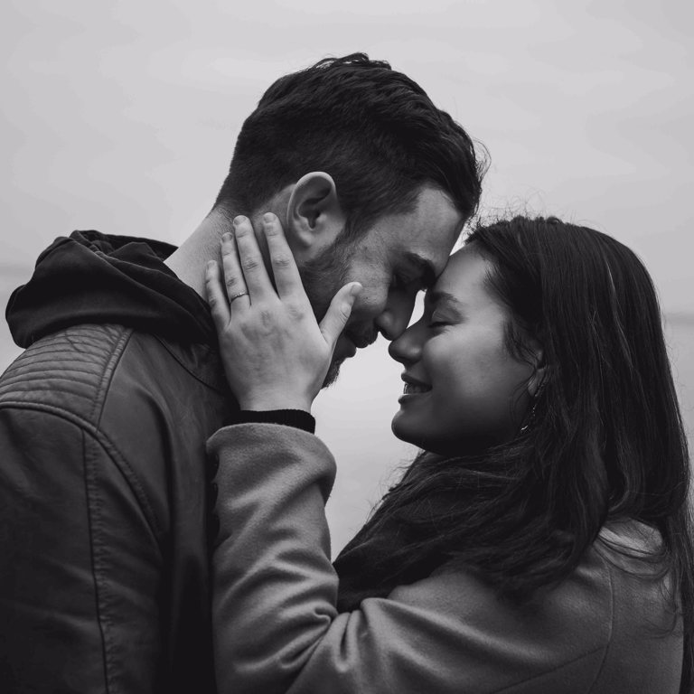 Engaged couple touch foreheads during pre-wedding photoshoot