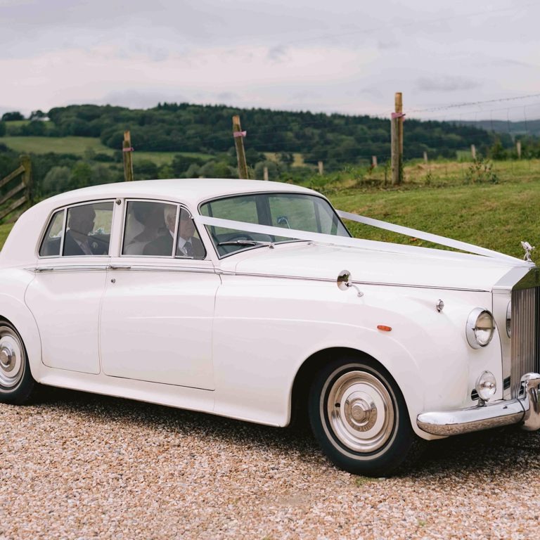 Bride arriving in wedding car for a Marquee wedding in Penyffordd North Wales