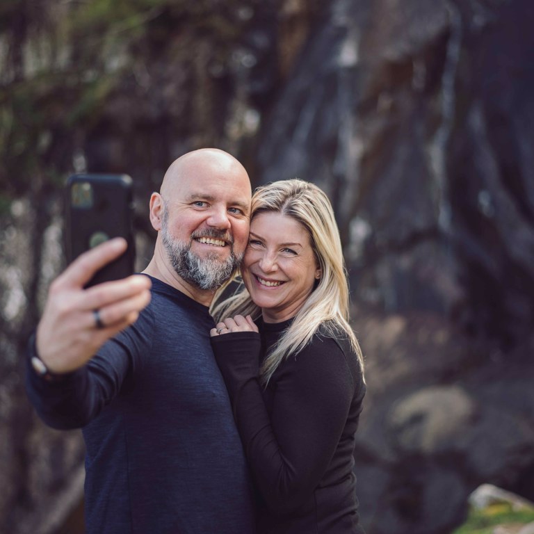 Couple take self portrait in front of Aber Falls North Wales