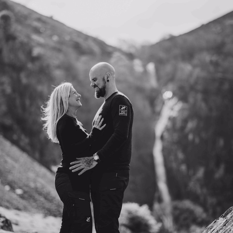 Couple look at each other during pre-wedding shoot at Aber Falls