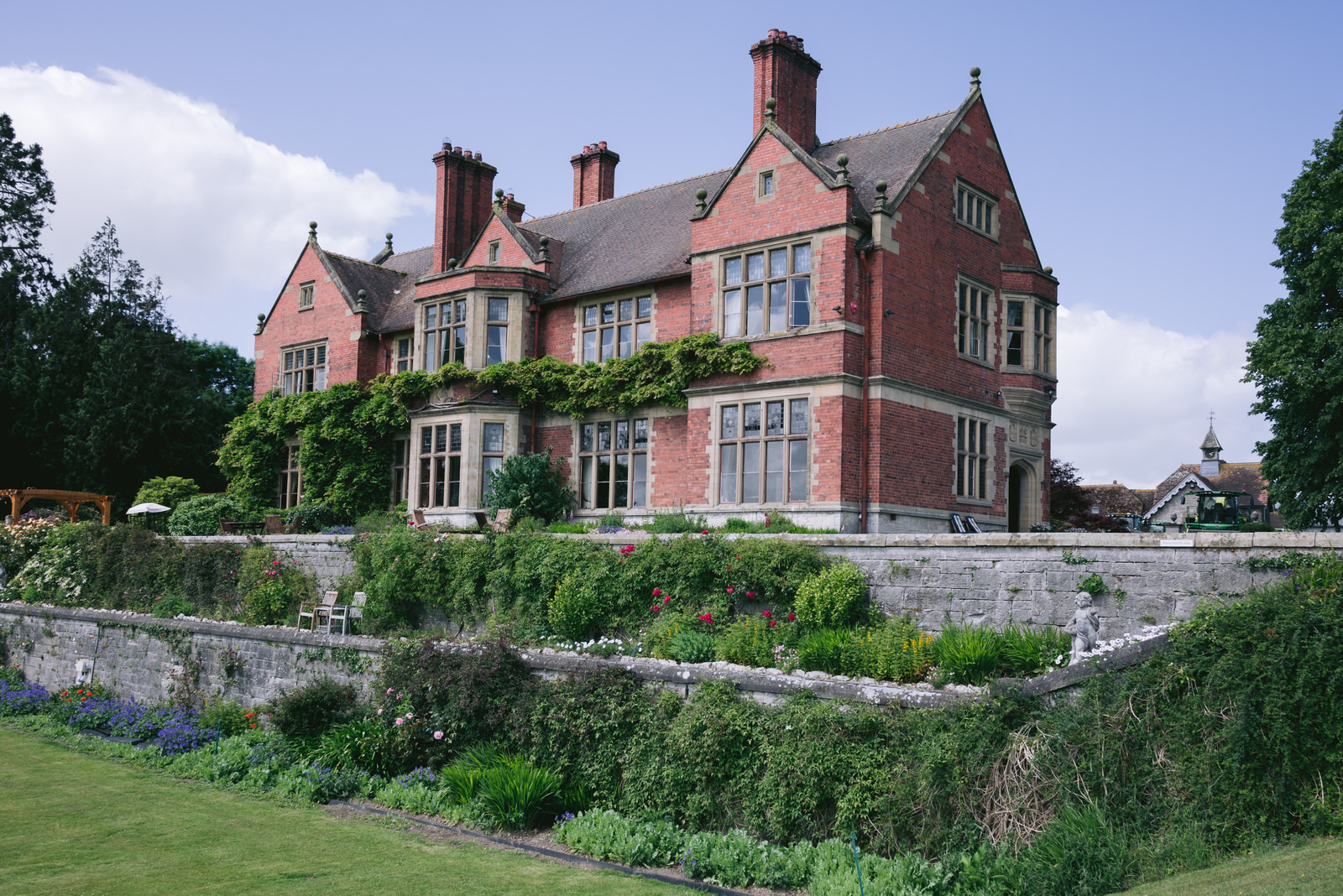 Exterior photograph of Wigfair Hall wedding venue showing the building a gardens