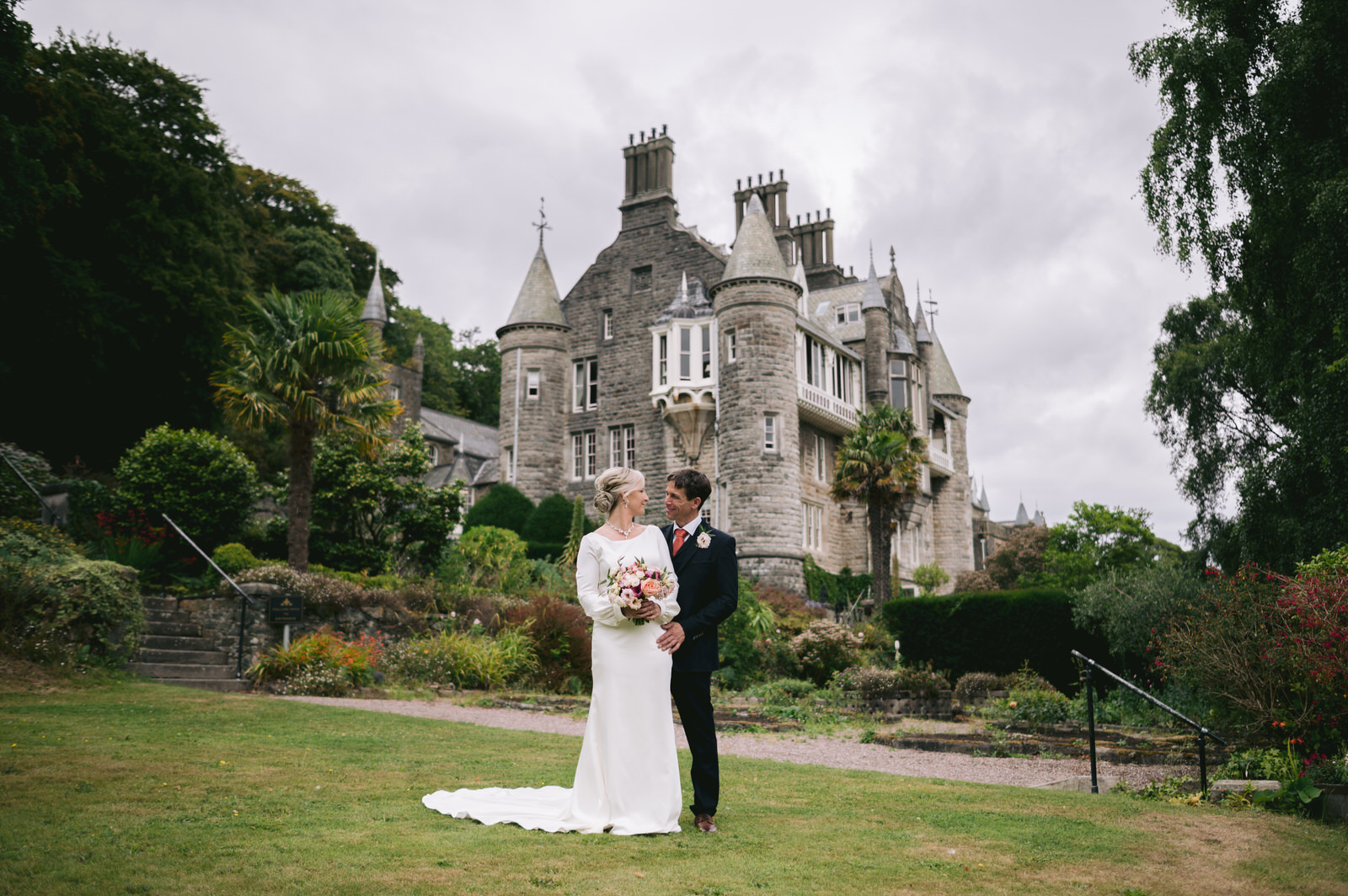 Bride & Groom looking at each other outside Château Rhianfa Anglesey