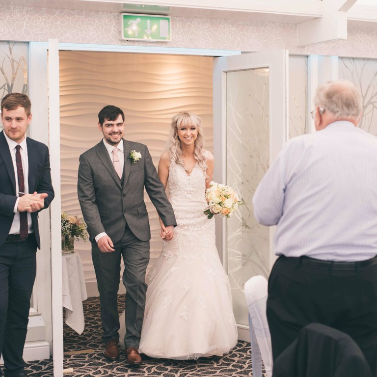 Bride and Groom entering wedding breakfast at Lion Quays hotel Oswestry