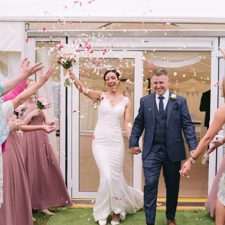 Bride and Groom confetti photograph at wedding in Penyffordd North Wales