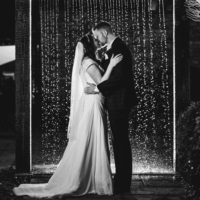 Evening time Wedding photography in front of water feature at Lion Quays