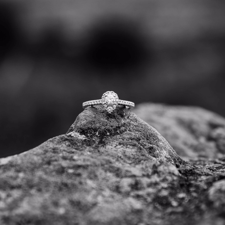 Engagement ring close up on rock in North Wales