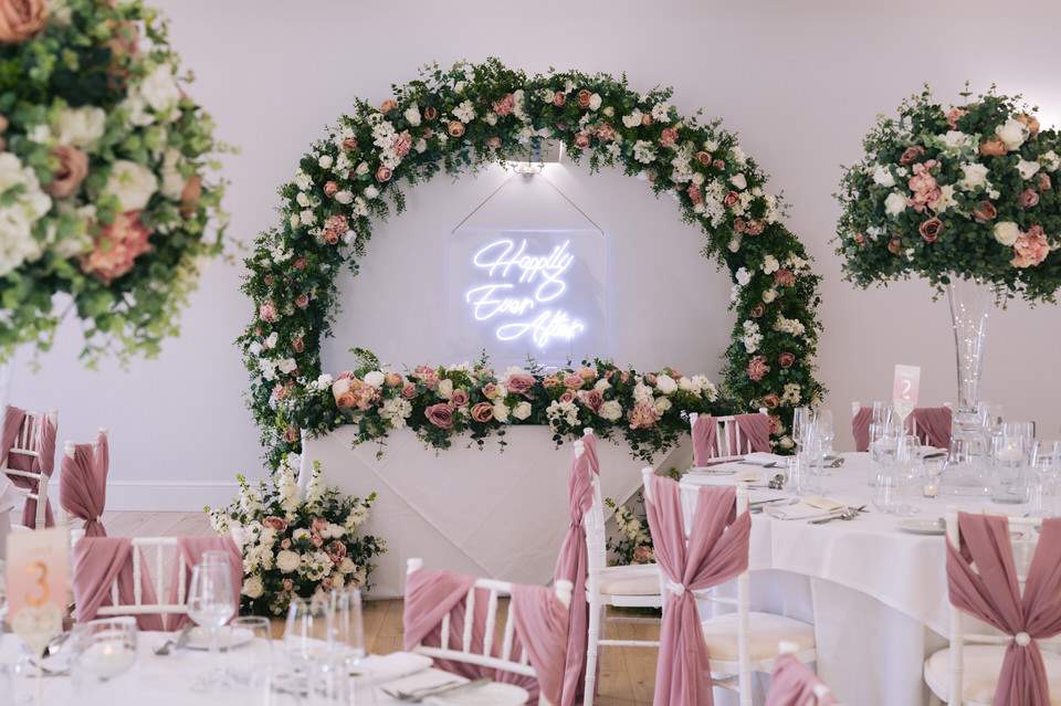 Wedding breakfast room at Highfield Hall dressed in blush pink and florals