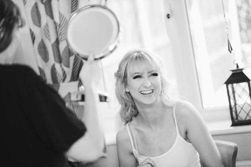 Bride to be laughs during wedding preparations