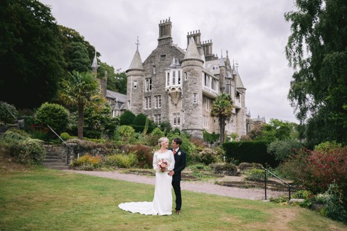 Bride & Groom embrace outside of Château Rhianfa during their wedding portrait session
