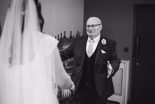 Father is emotional at first look during wedding at Lion Quays