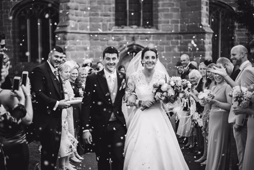 Bride & Groom get showered in confetti outside a Church in Cheshire